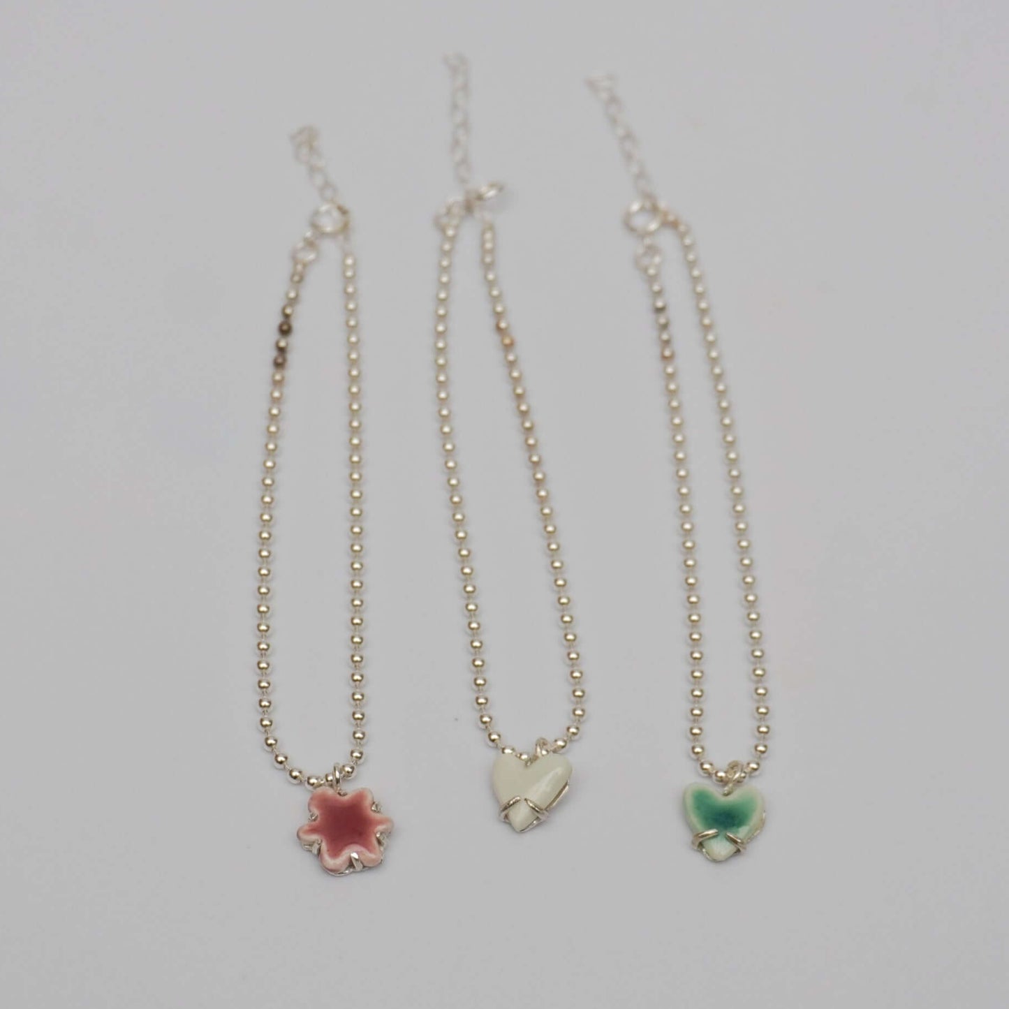 Silver bracelets with porcelain pendants - pink kindness, white love and green love