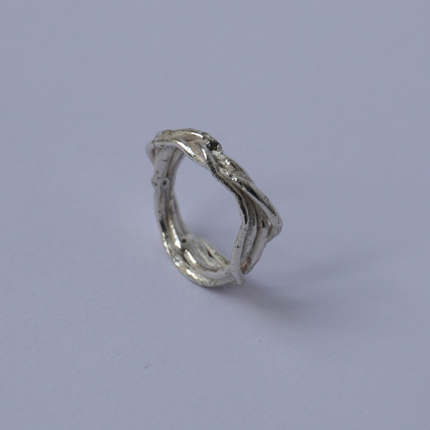 Twisted Band Silver Ring with Olive Green Cubic Zirconias