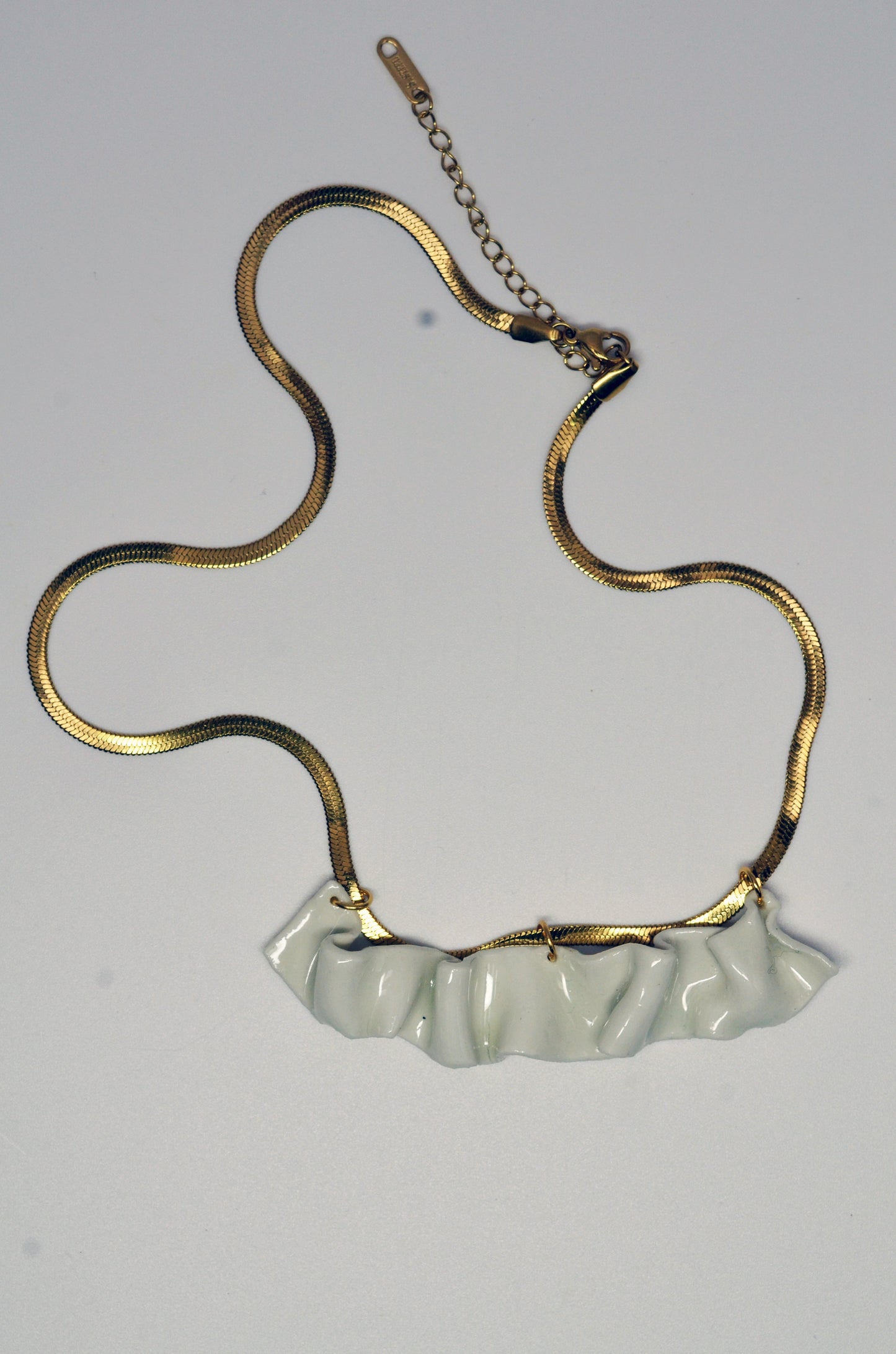 resilience porcelain necklace.