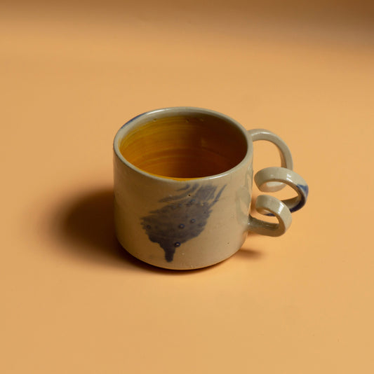 GIVE IT A TWIST handmade ceramics mug orange interior and blue brushes