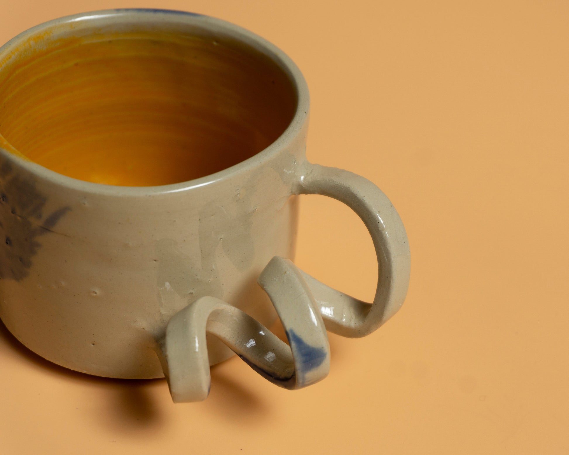 GIVE IT A TWIST handmade ceramics mug orange interior and blue brushes
