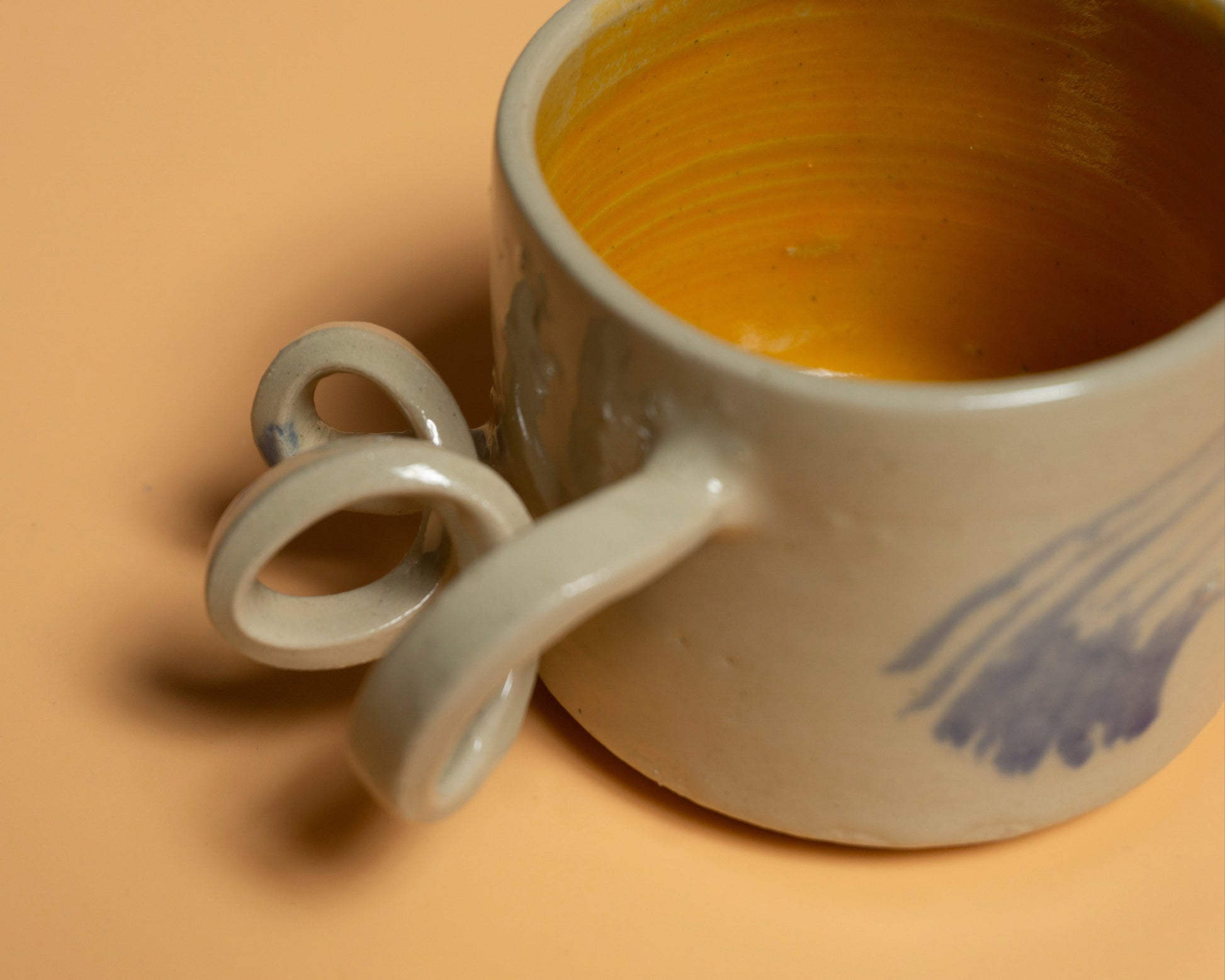 GIVE IT A TWIST handmade ceramics mug orange interior and blue brushes