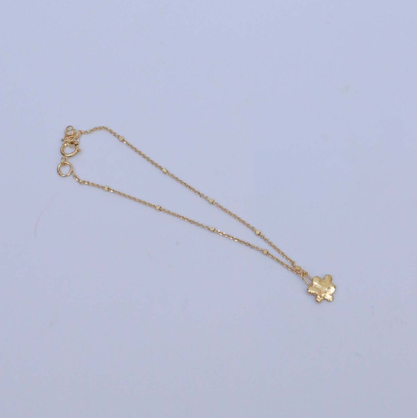 Handmade gold-plated silver bracelet with little flower pendant