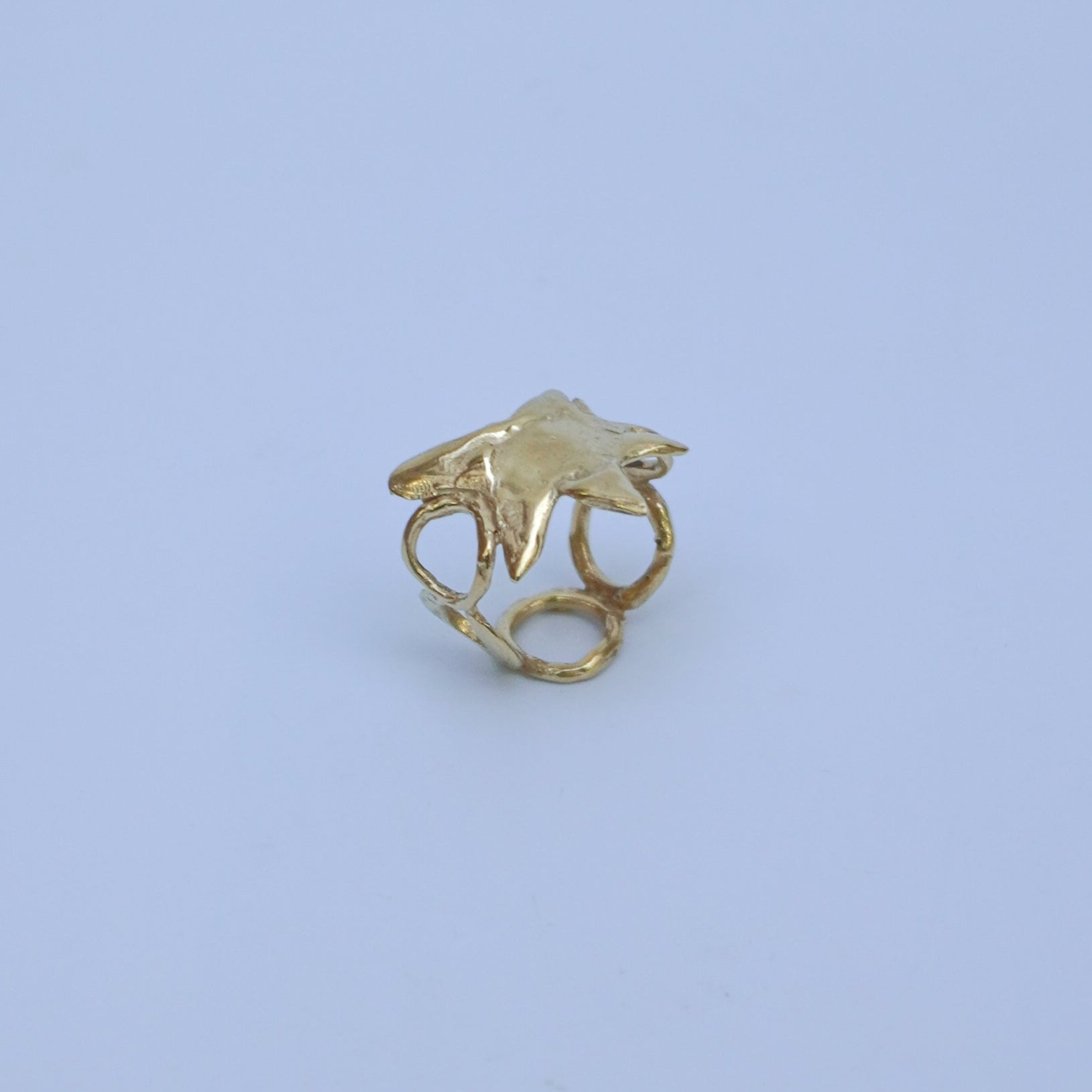 Gold-plated brass, gold-plated silver or silver ring with a star and circles