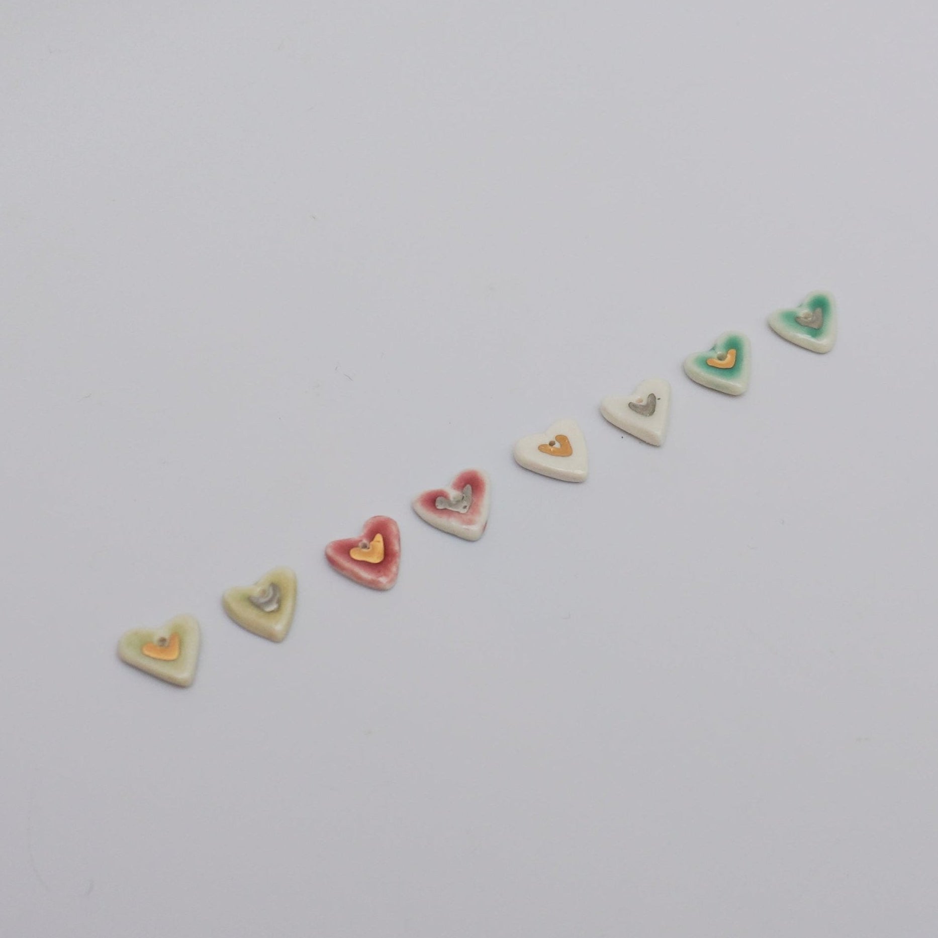 Porcelain pendants with gold and silver lusters