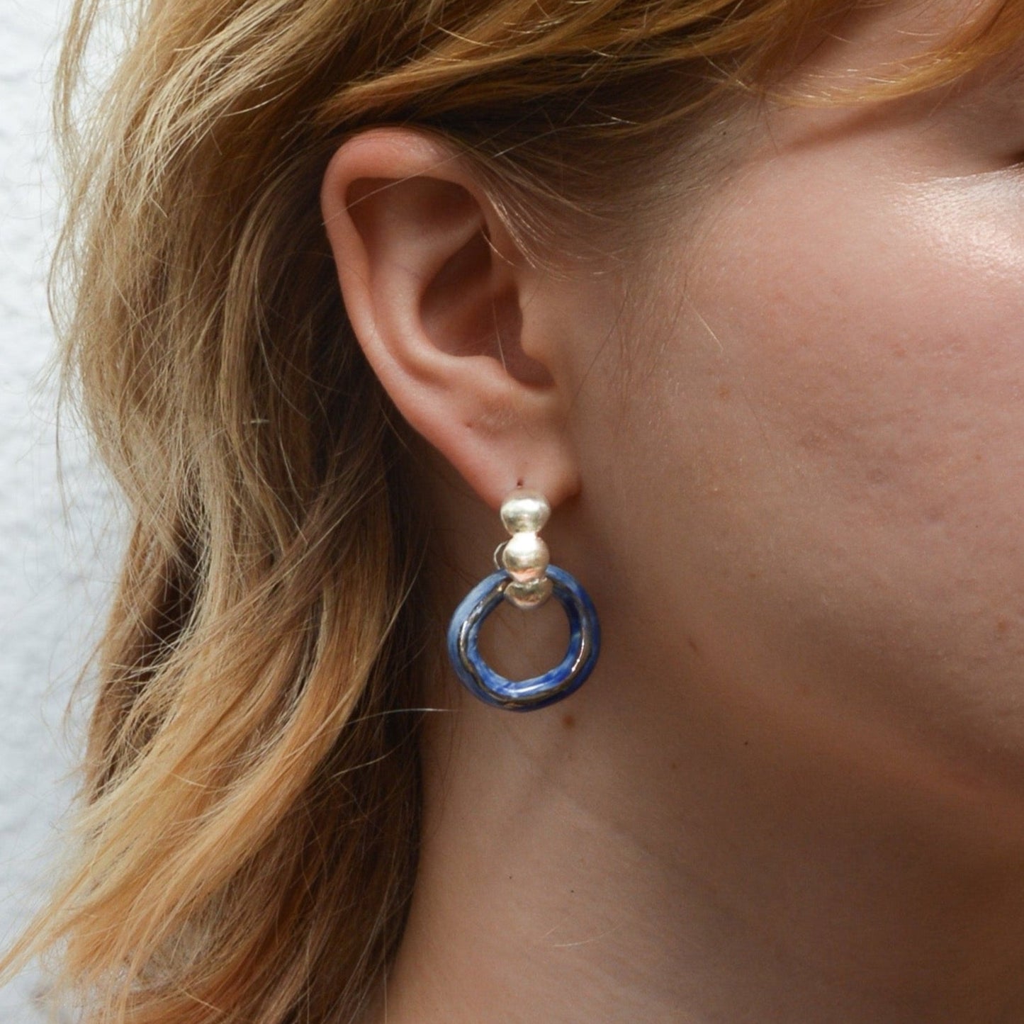 dancing digging deep earring luster silver blue hoop
