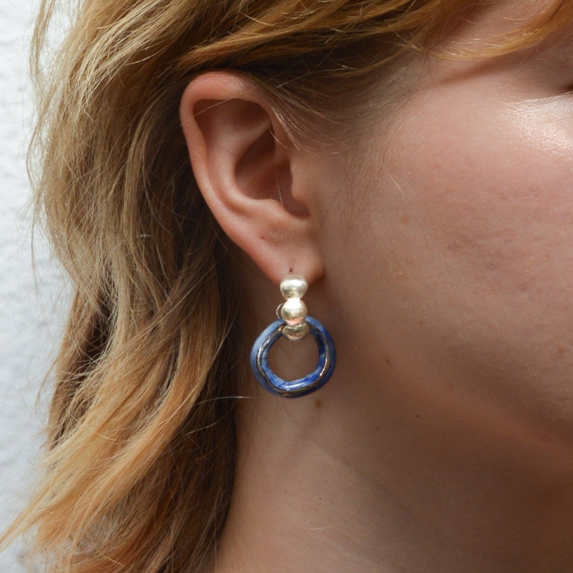 dancing digging deep earring luster silver blue hoop