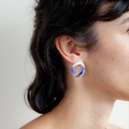 Artisanal Handmade Porcelain Earrings Porcelain Blue and White with Gold or Silver Detail. Lightweight Oval-Shaped Hoops That Blend Minimalist Elegance With a Bold, Contemporary Look. Perfect for Statement Jewelry Lovers Seeking Unique, Handcrafted Pieces.