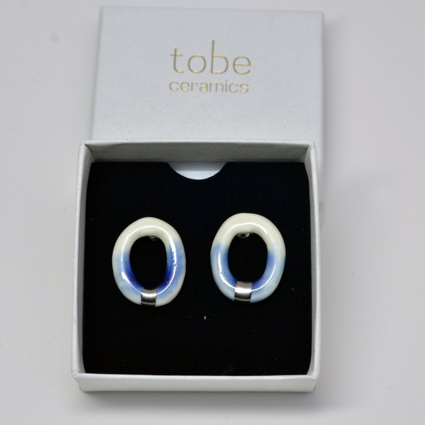 digging deep earring hoop blue white luster silver