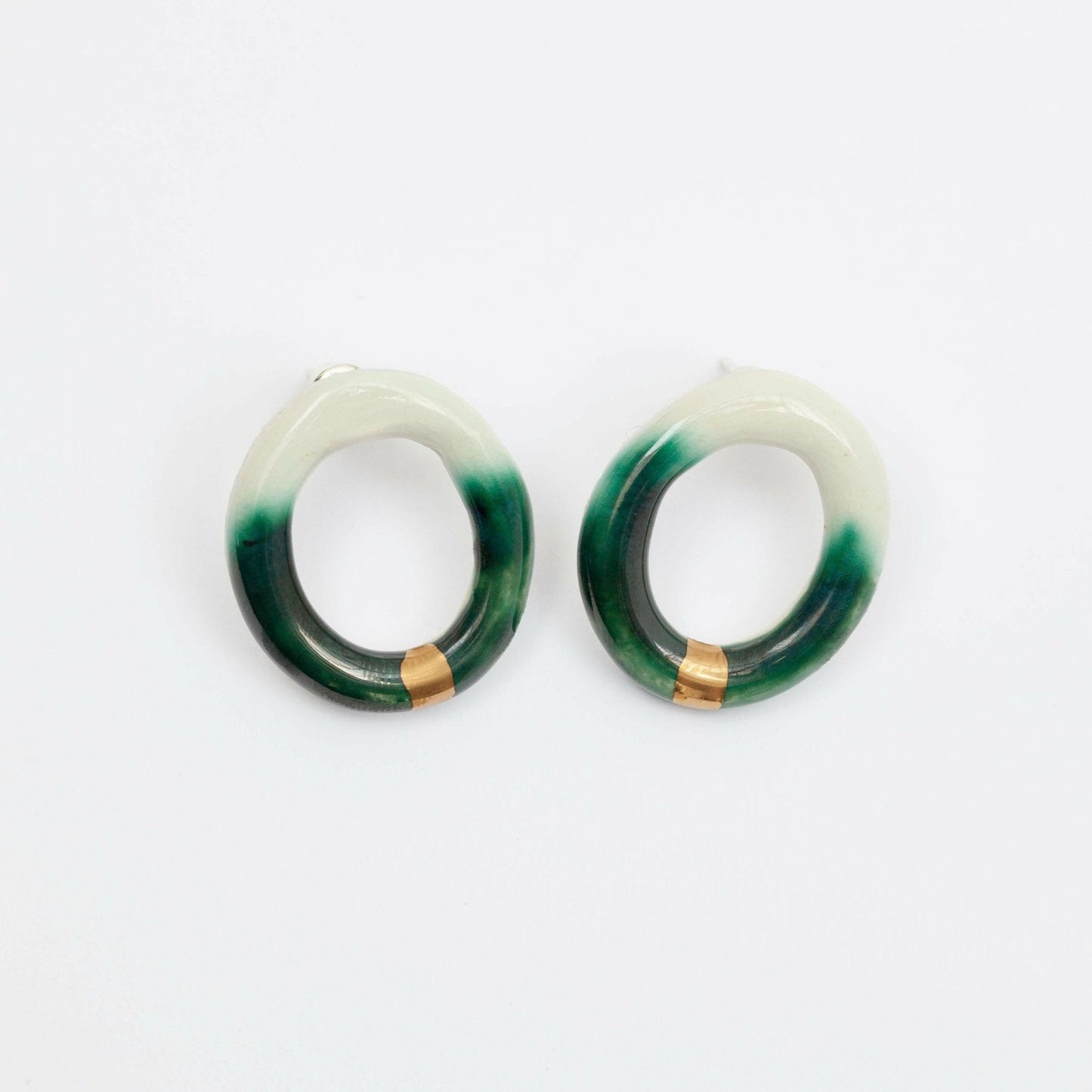 Handmade Gree Porcelain Hoop Earring With Organic Open Circle Design, Worn as a Bold Stud. Lightweight Ceramic Statement Earring for Minimalist and Contemporary Jewelry Styles