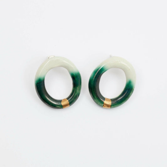 Handmade Gree Porcelain Hoop Earring With Organic Open Circle Design, Worn as a Bold Stud. Lightweight Ceramic Statement Earring for Minimalist and Contemporary Jewelry Styles