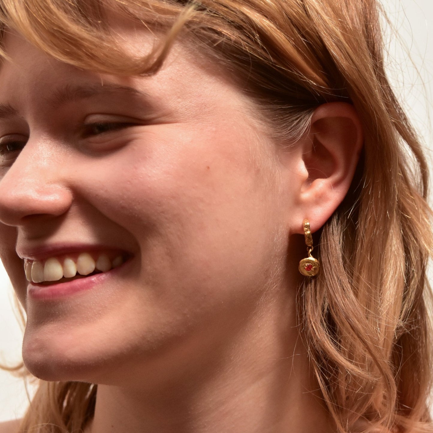 organic gold hoop earring round pendant stone