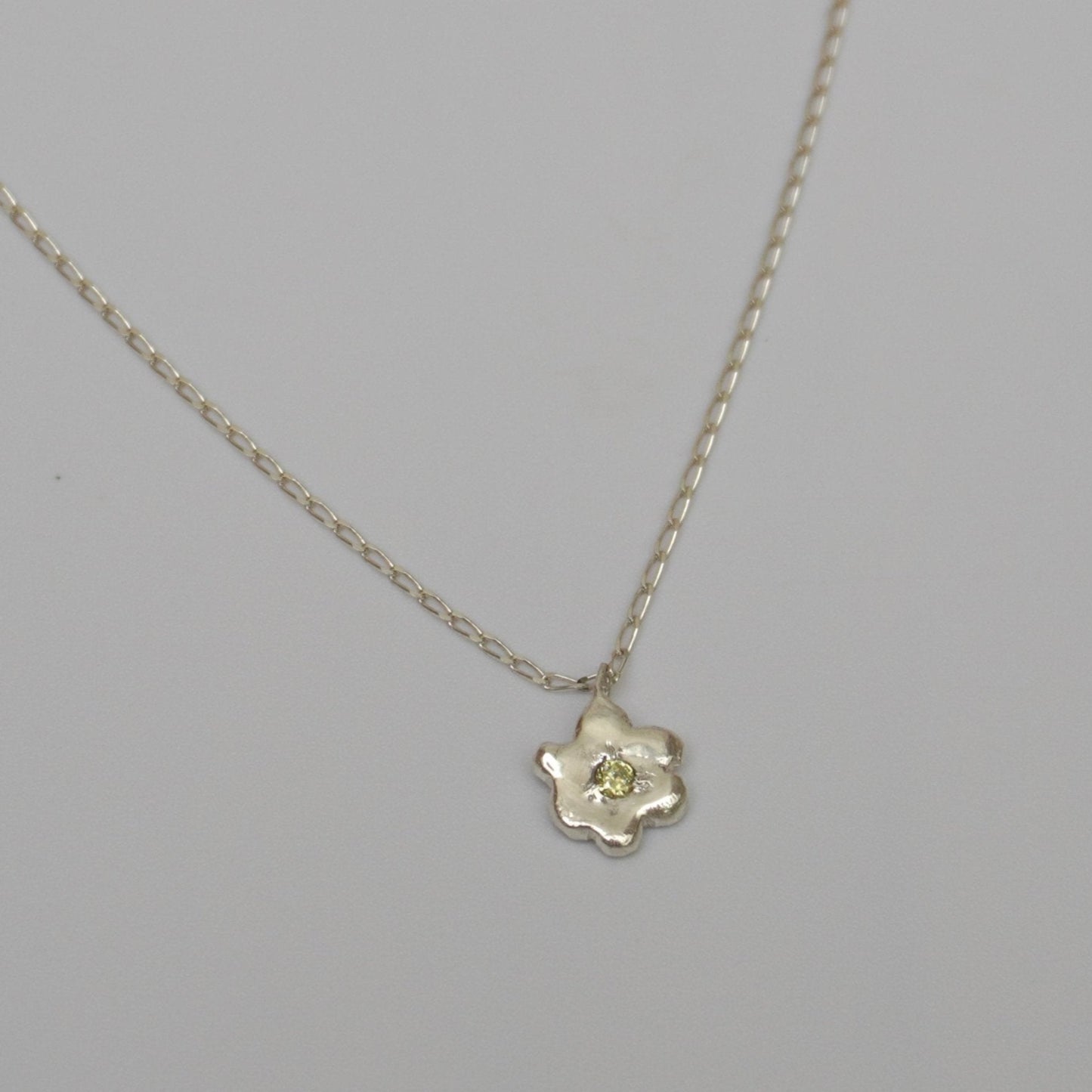 organic metal pendant necklace silver flower kindness stone green