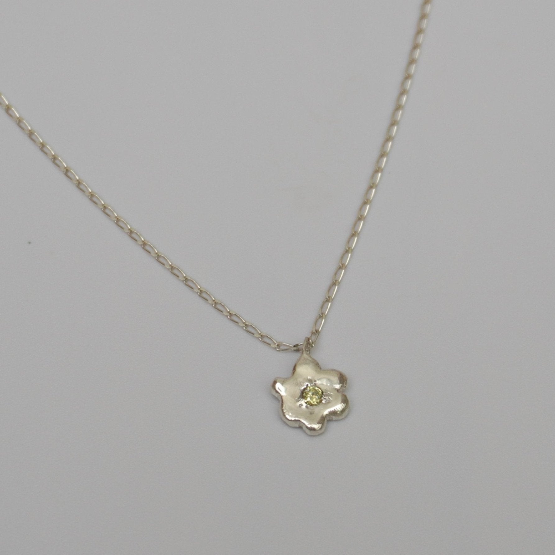 organic metal pendant necklace silver flower kindness stone green