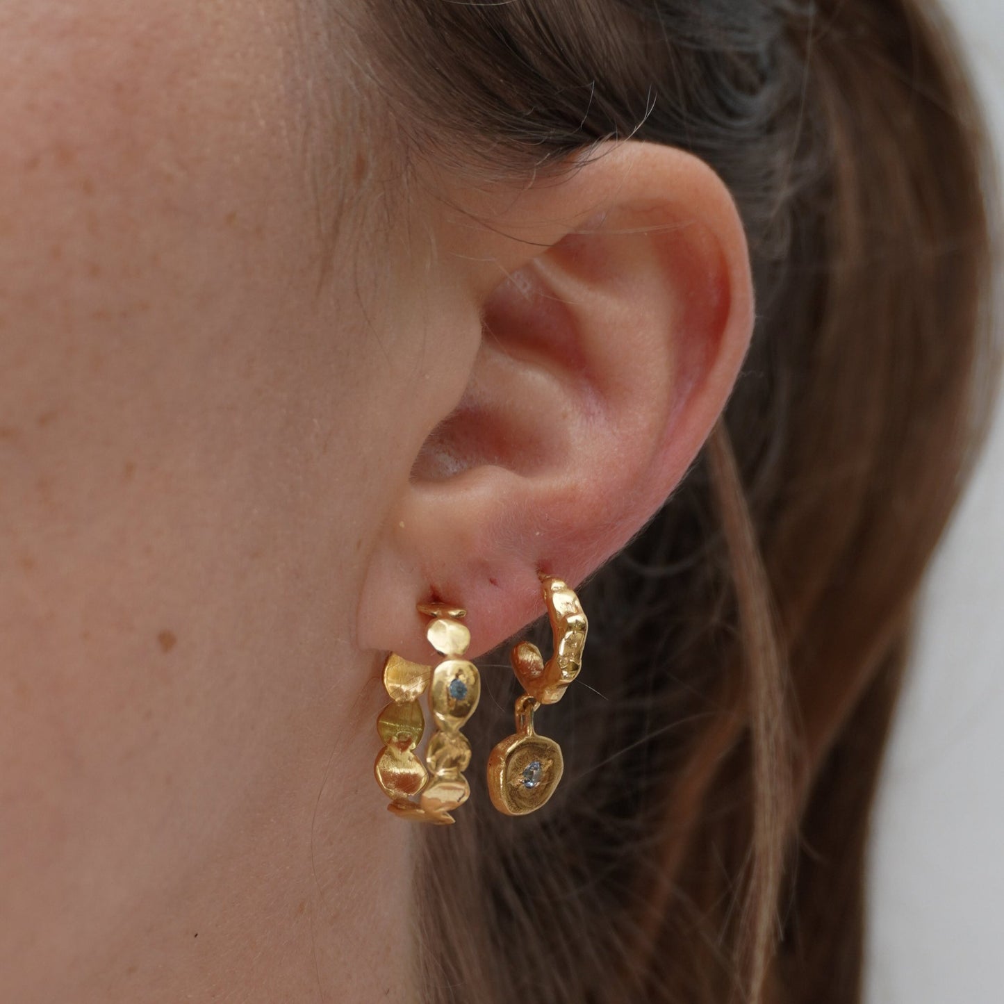 organic gold hoop earring round simplicity stone