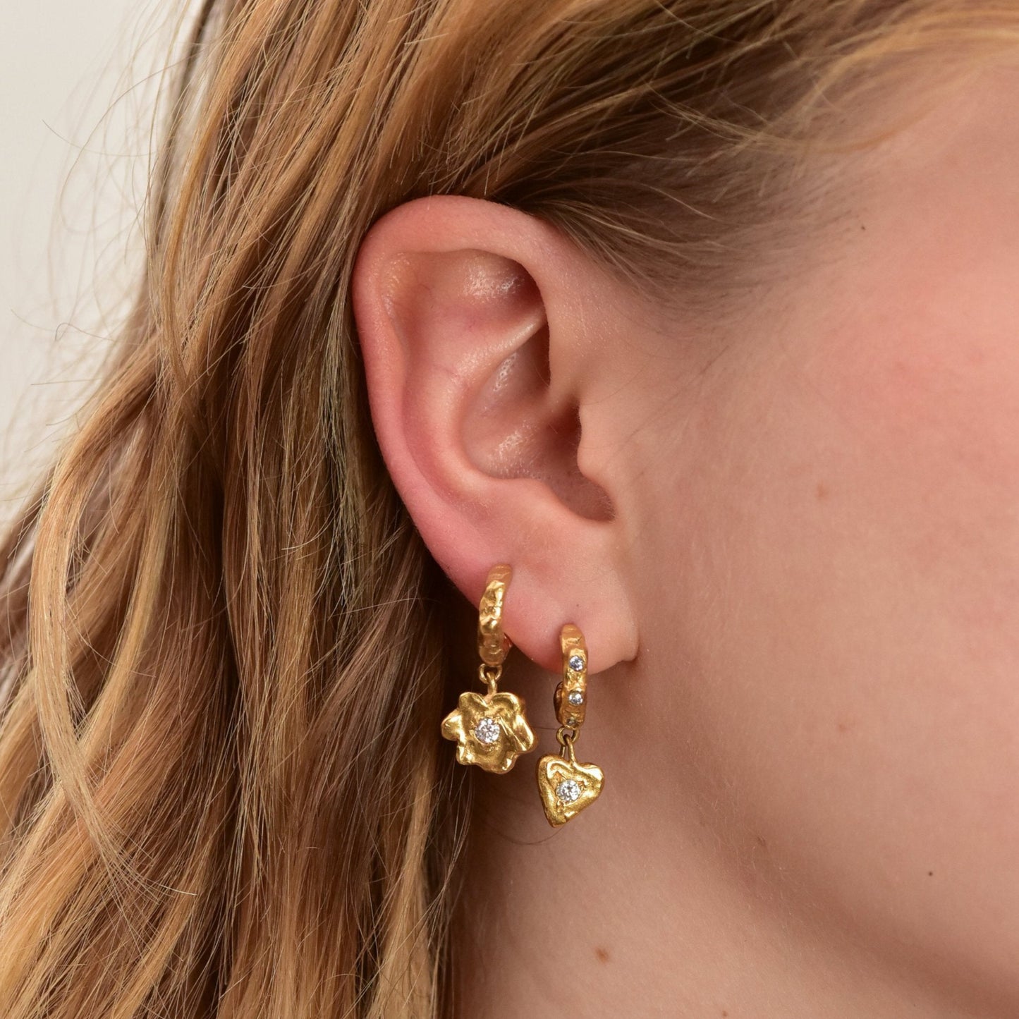 organic gold hoop earring flower heart pendant stone