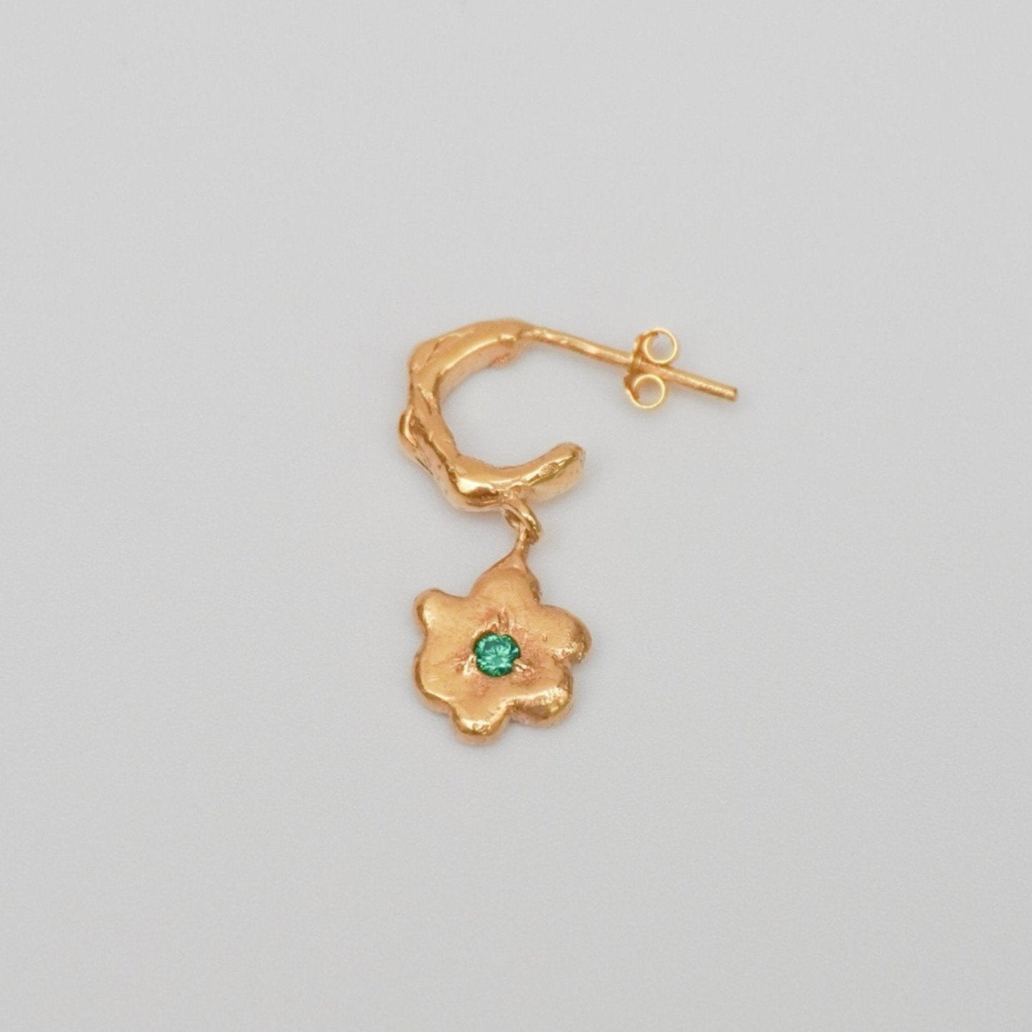 organic gold hoop earring with flower pendant