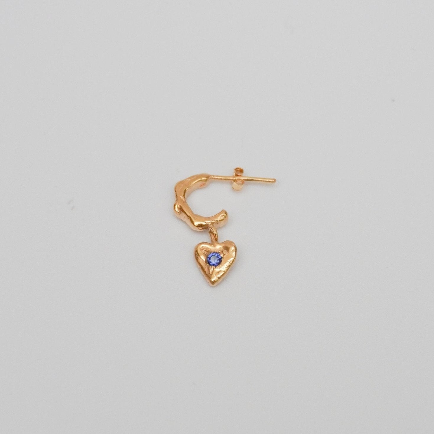 organic gold hoop earring heart pendant stone