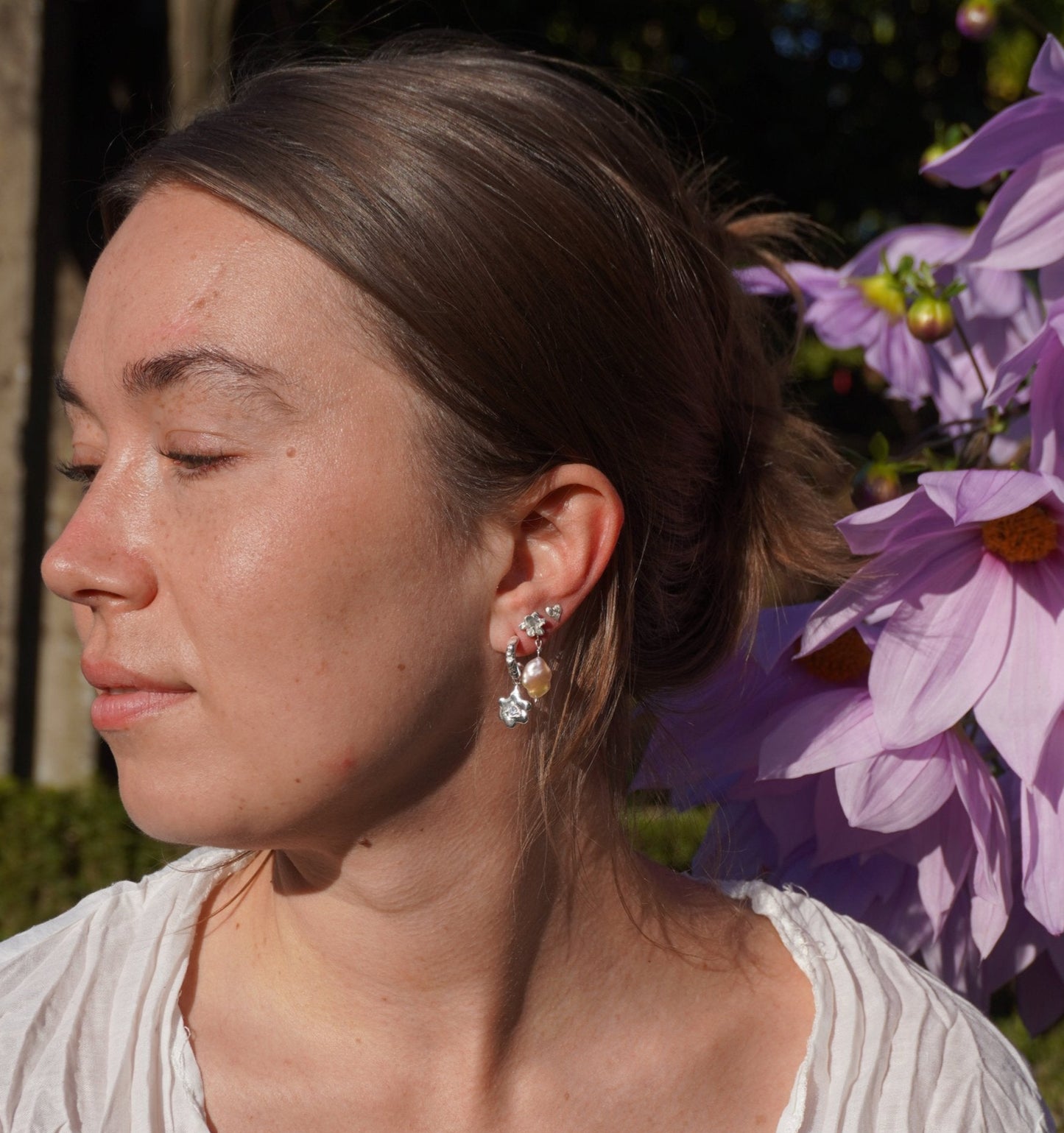 organic silver hoop earring with flower pendant