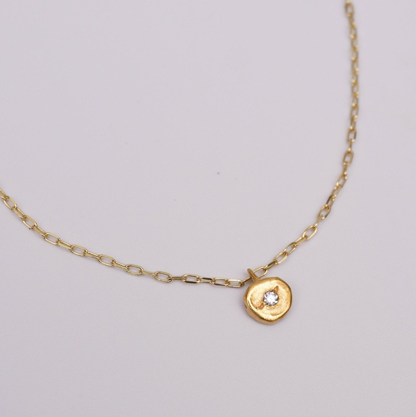 organic metal pendant necklace gold kindness round stone white