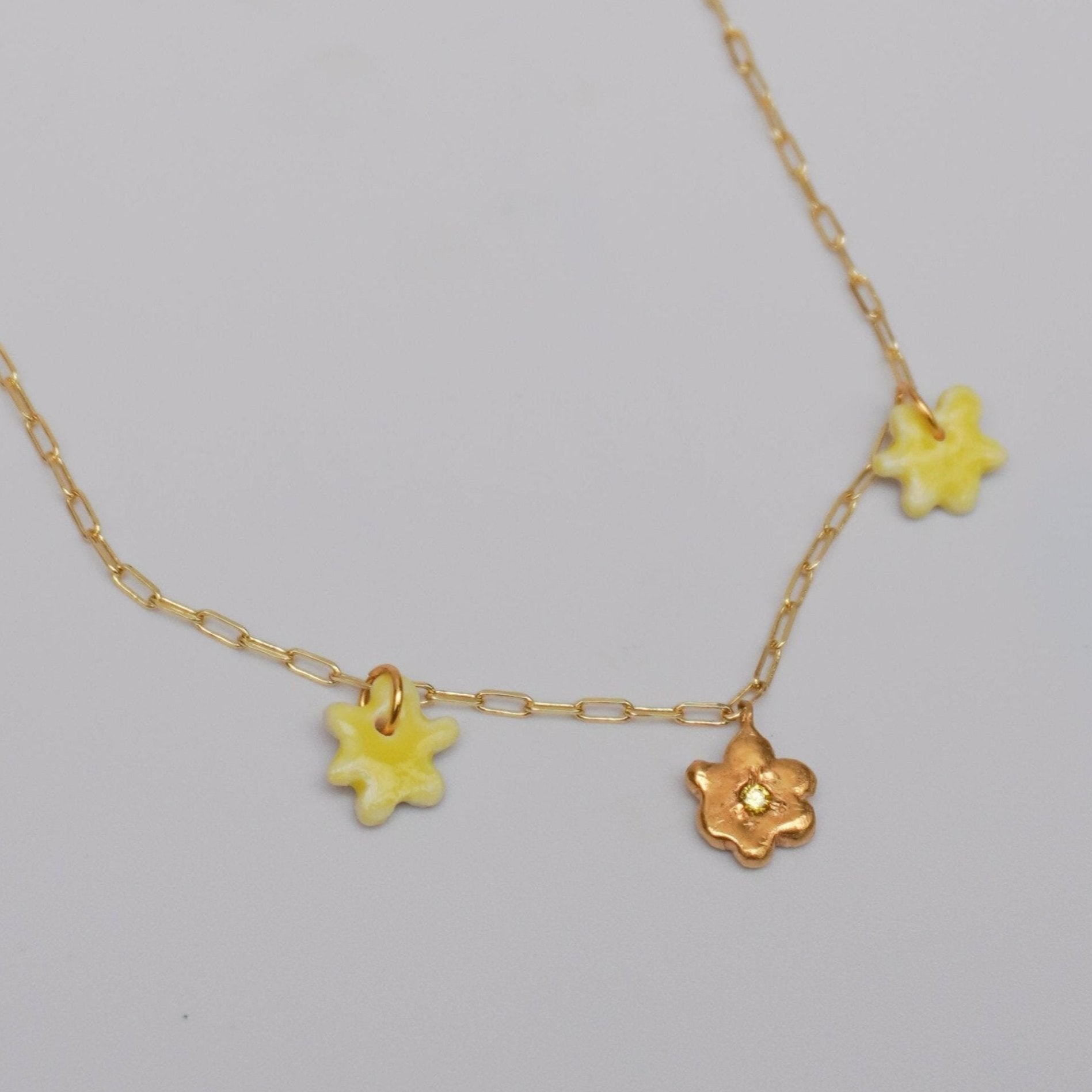 organic multi pendant necklace kindness flower yellow stone