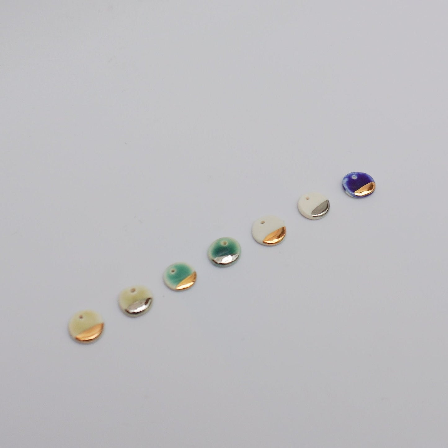 Porcelain pendants with silver/gold luster details