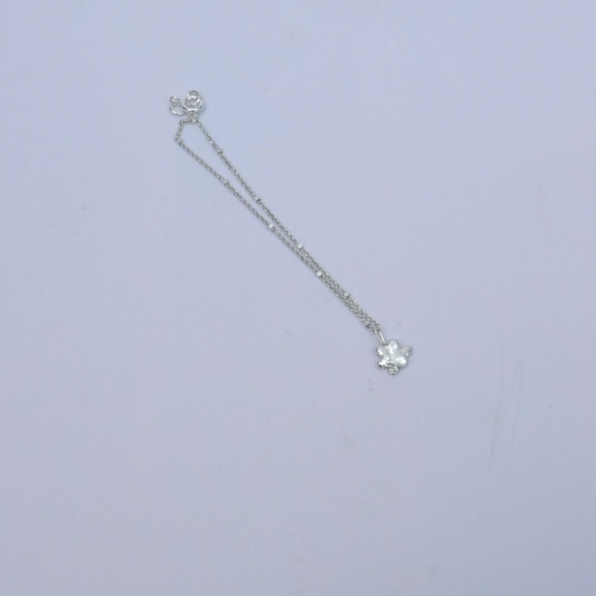 Silver bracelet with little pendant - flower