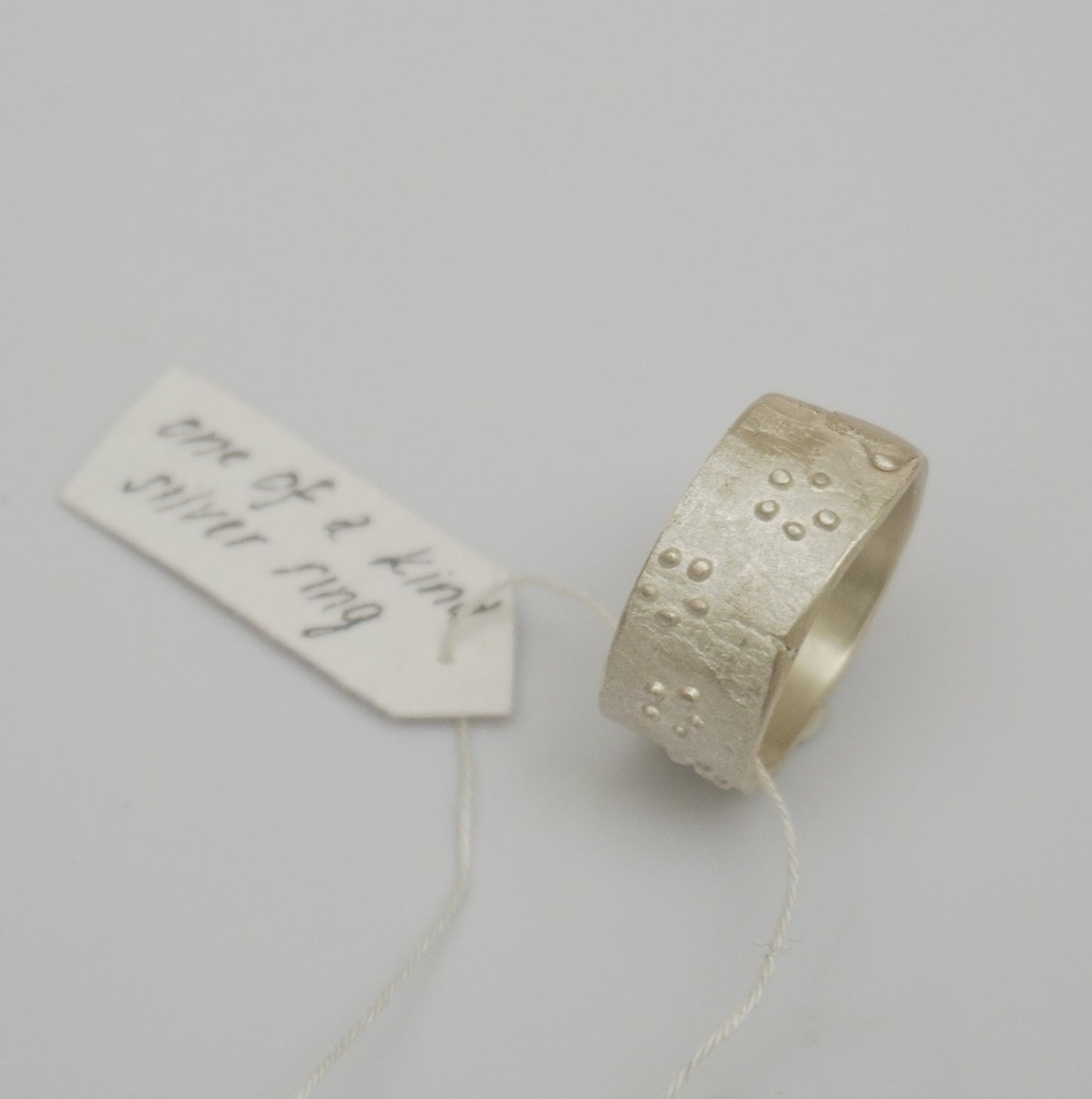 Handcrafted premium sterling silver ring with intricate dot detailing. Unique rough texture and artisanal craftsmanship