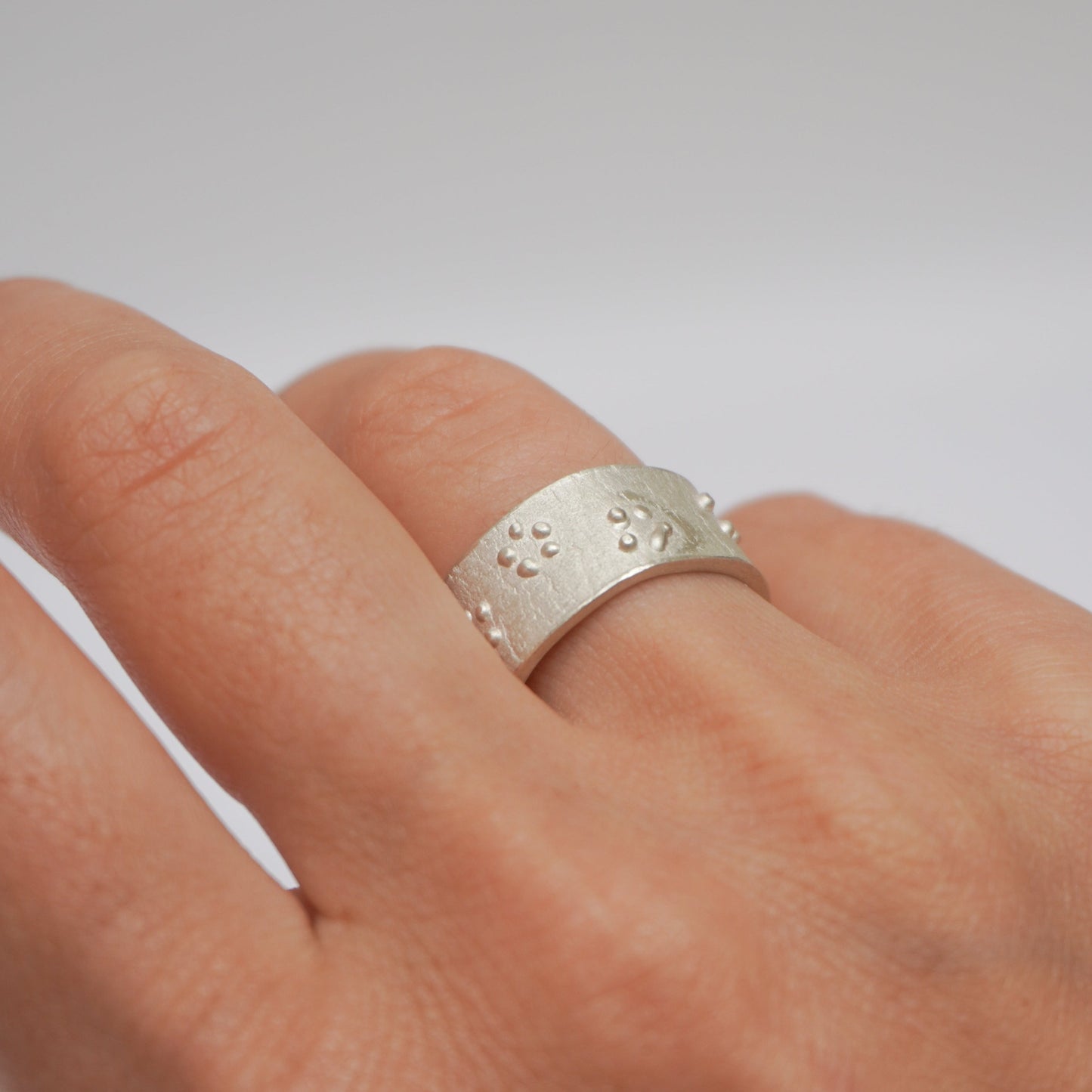 Handcrafted premium sterling silver ring with intricate dot detailing. Unique rough texture and artisanal craftsmanship