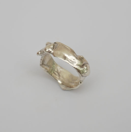 Handcrafted sterling silver ring inspired by the natural, organic movement. Featuring a distinctive wave-like design and intricate textured details.