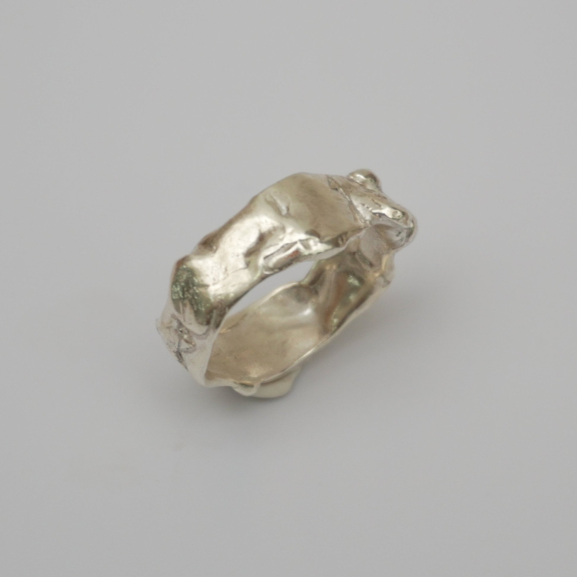 Handcrafted sterling silver ring inspired by the natural, organic movement. Featuring a distinctive wave-like design and intricate textured details.