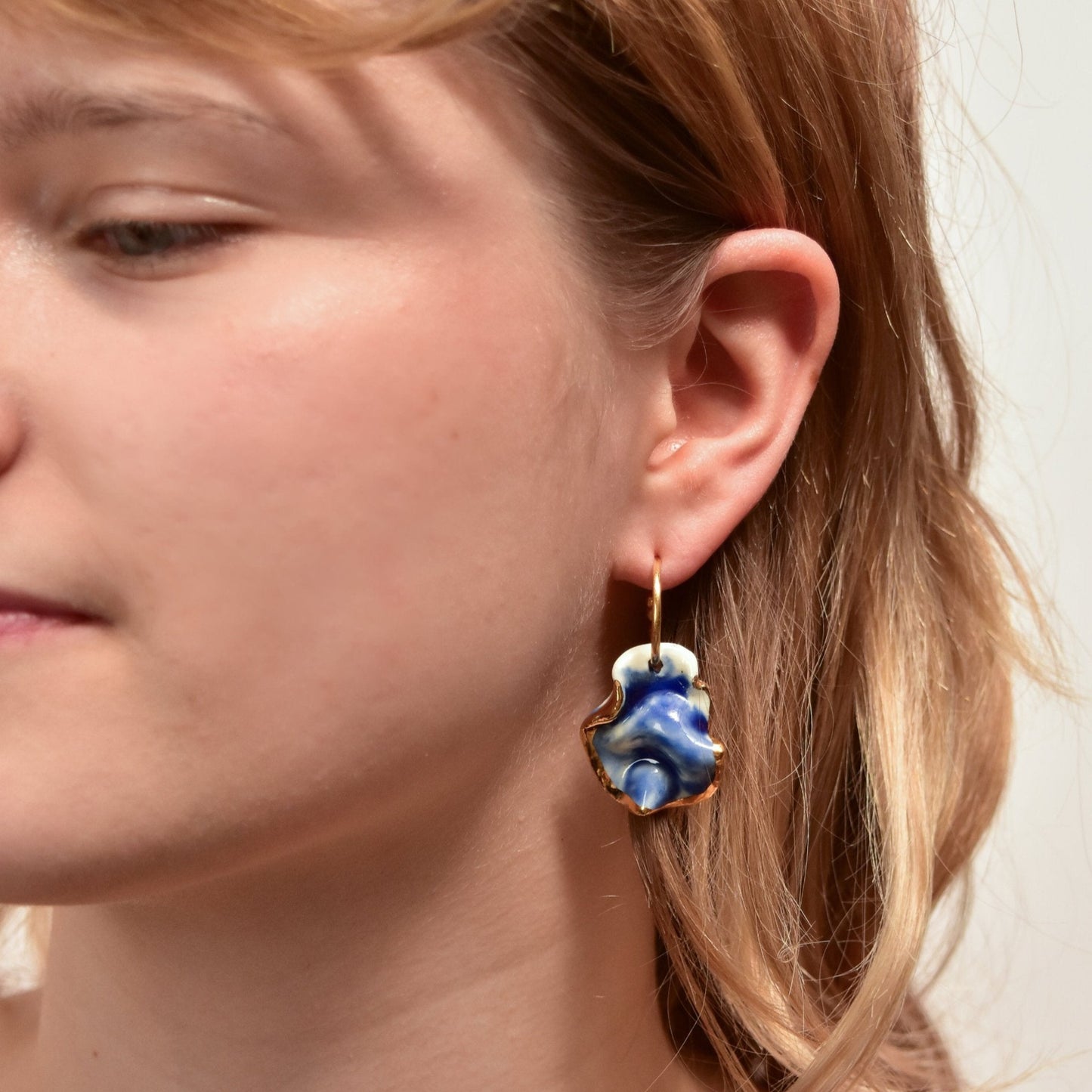 midnight calm resilience blue earring porcelain gold luster detail