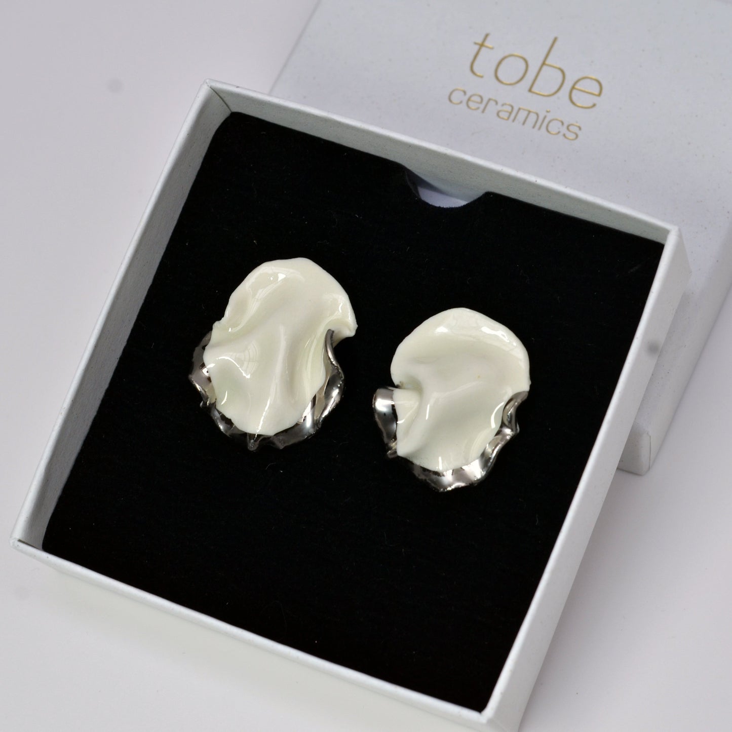 silent strenght handmade porcelain earrings with silver luster