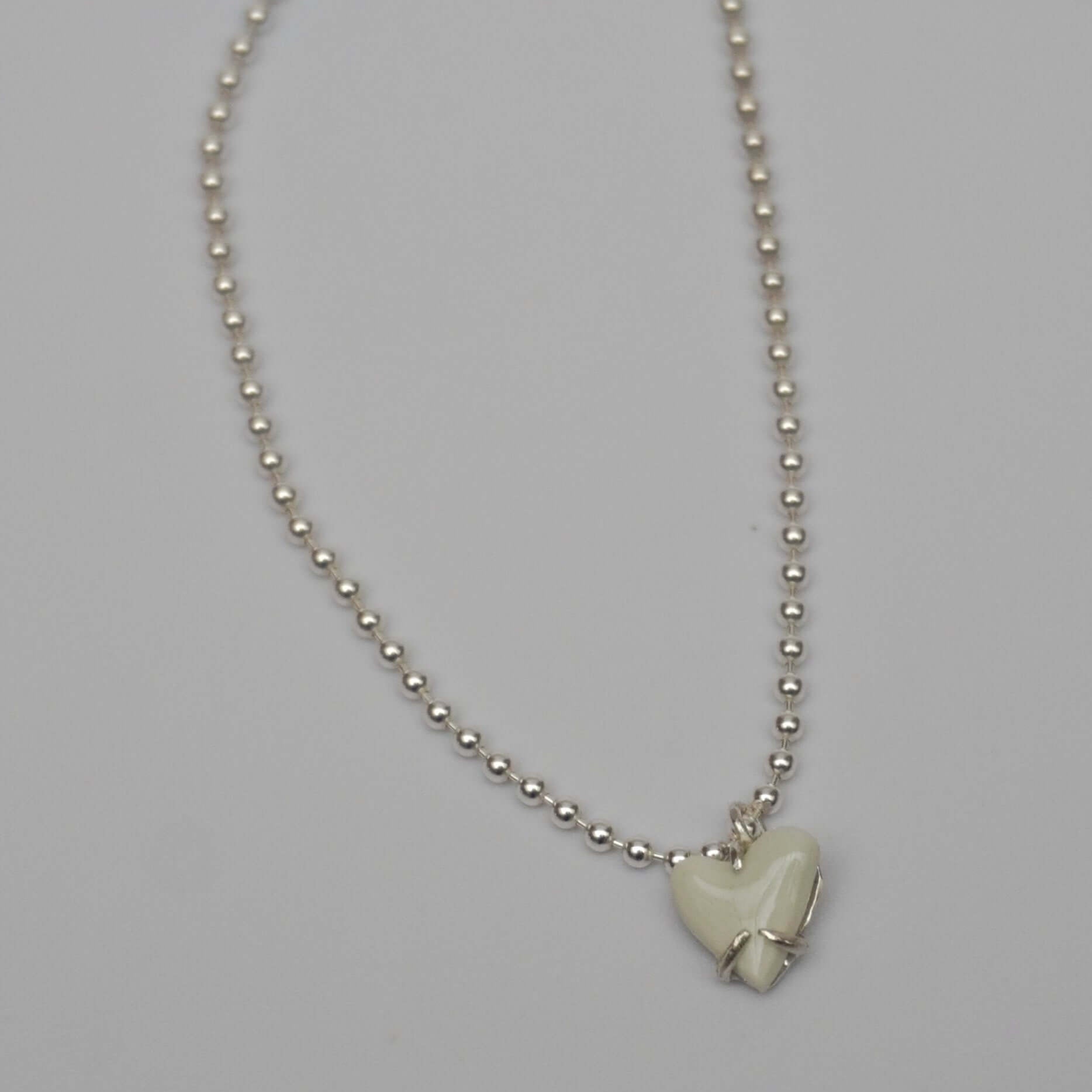 Silver bracelet with white love porcelain pendant
