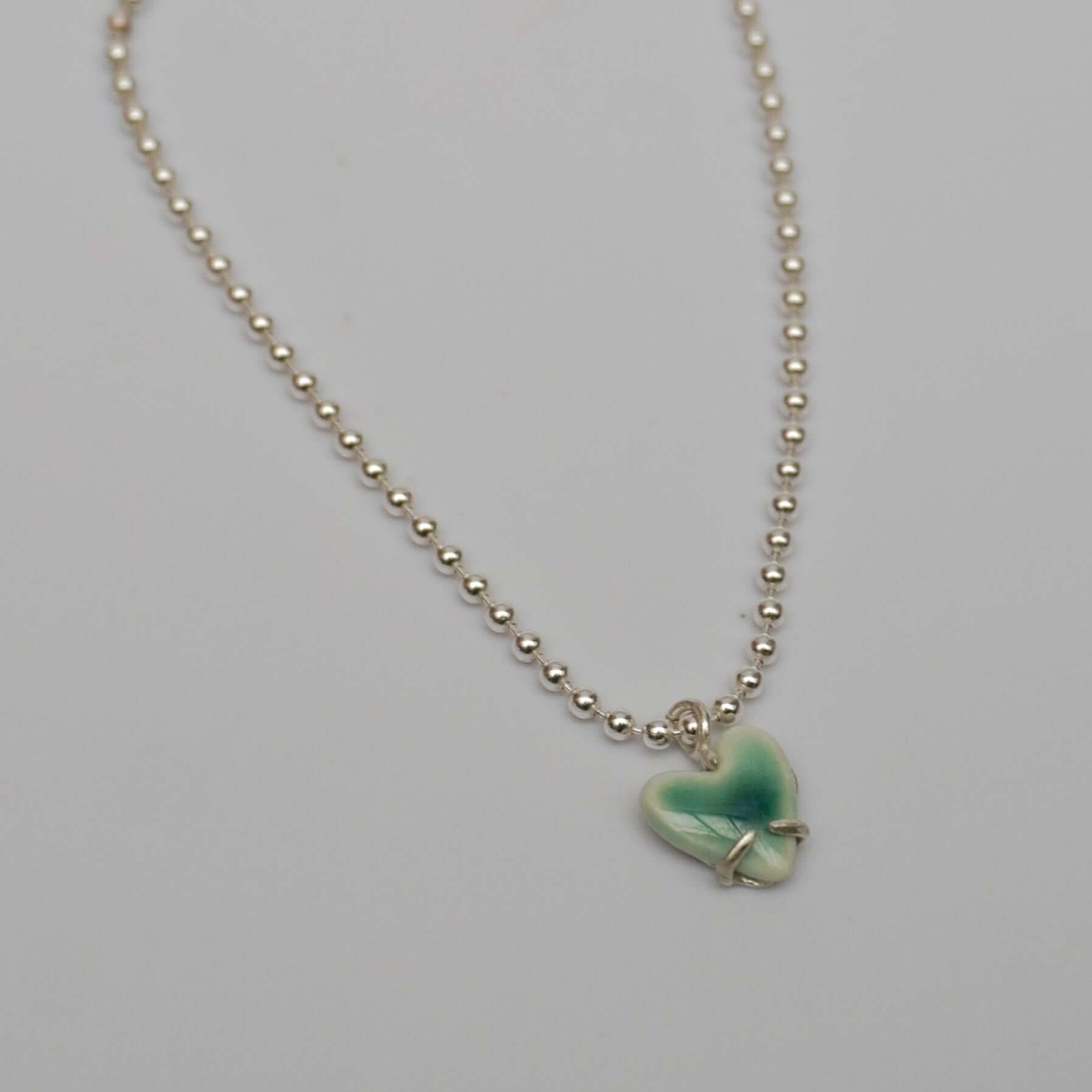 Silver bracelet with porcelain emerald green love pendant