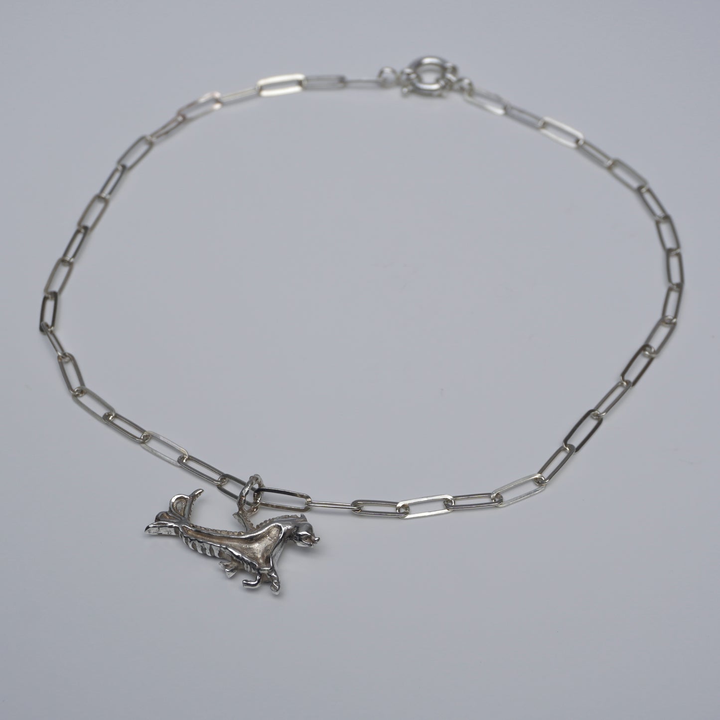 Handcrafted silver choker with sculptural creature pendant and rectangular-link chain