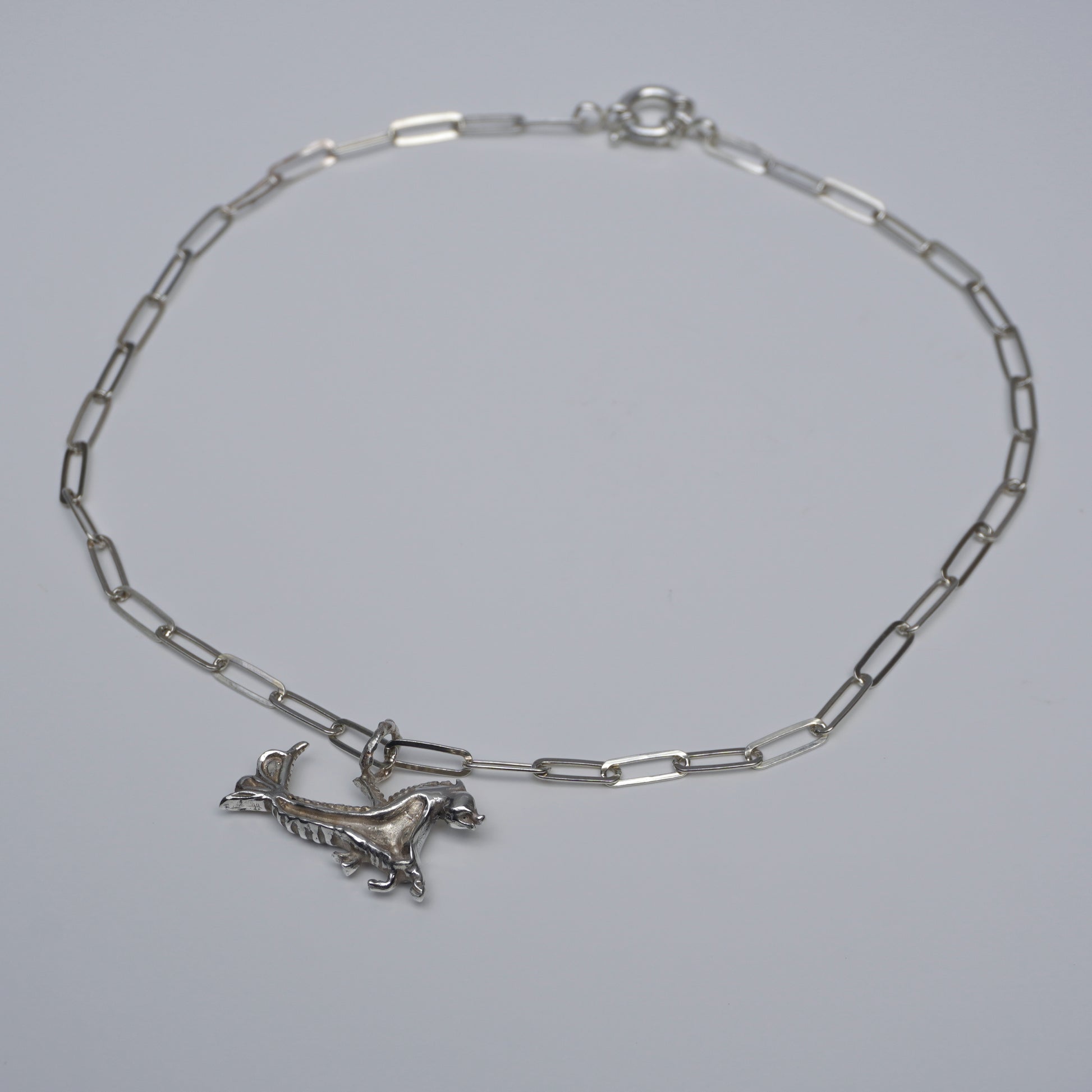 Handcrafted silver choker with sculptural creature pendant and rectangular-link chain