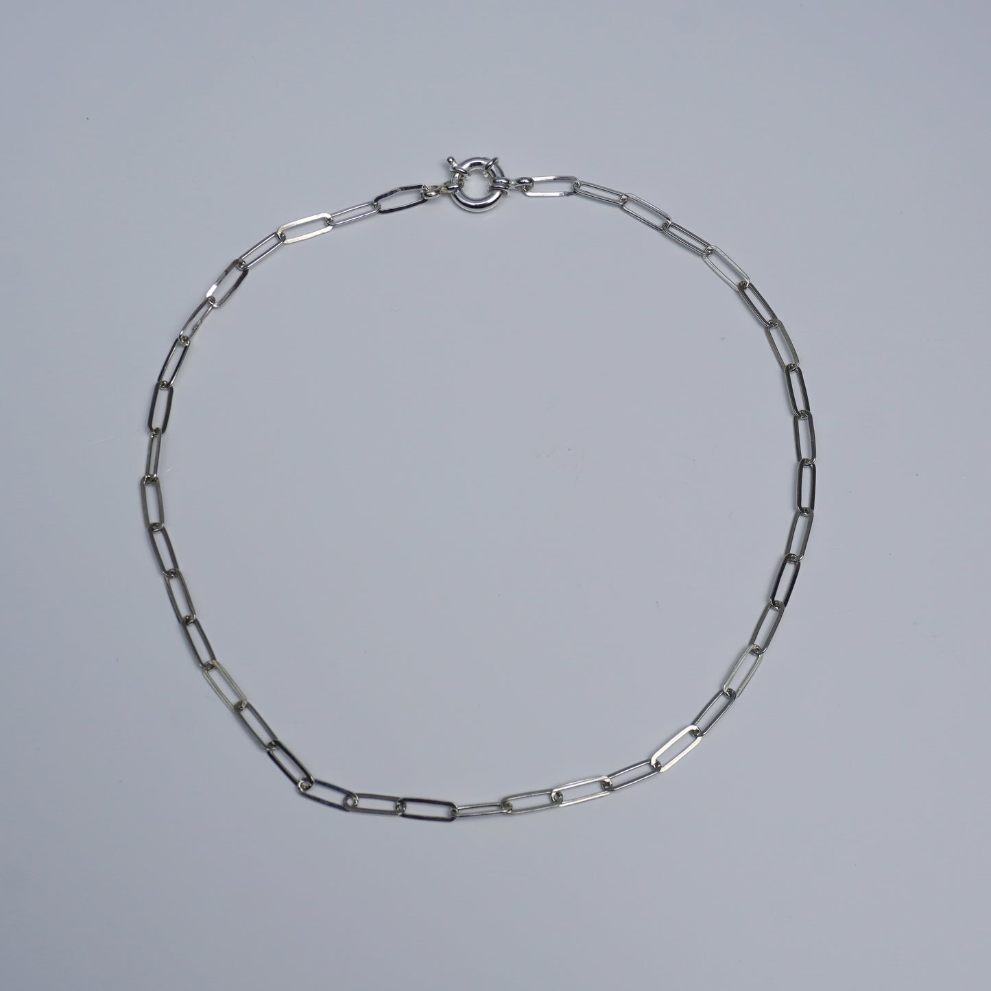 Handcrafted silver choker with sculptural creature pendant and rectangular-link chain