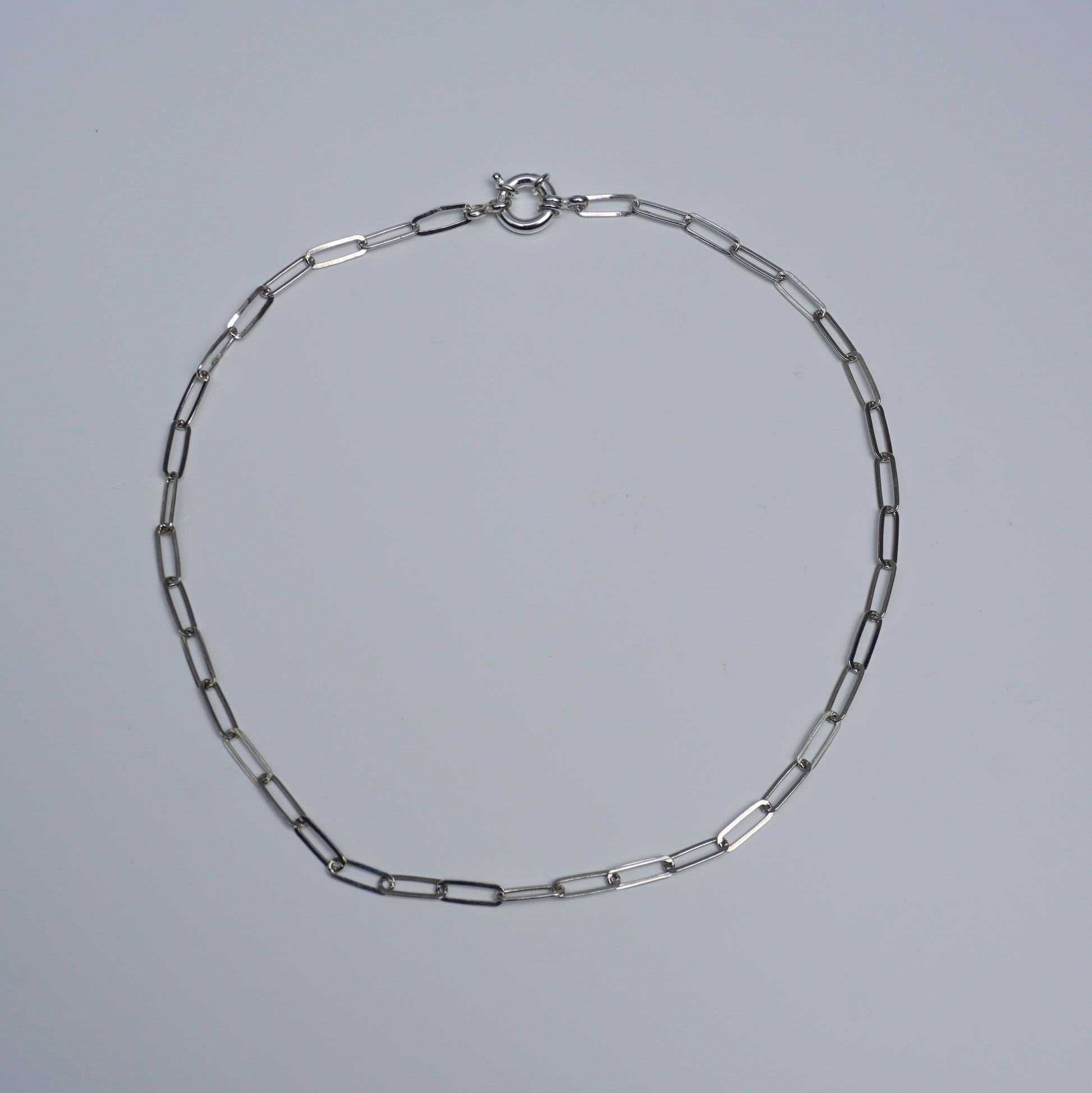 Handcrafted silver choker with sculptural creature pendant and rectangular-link chain