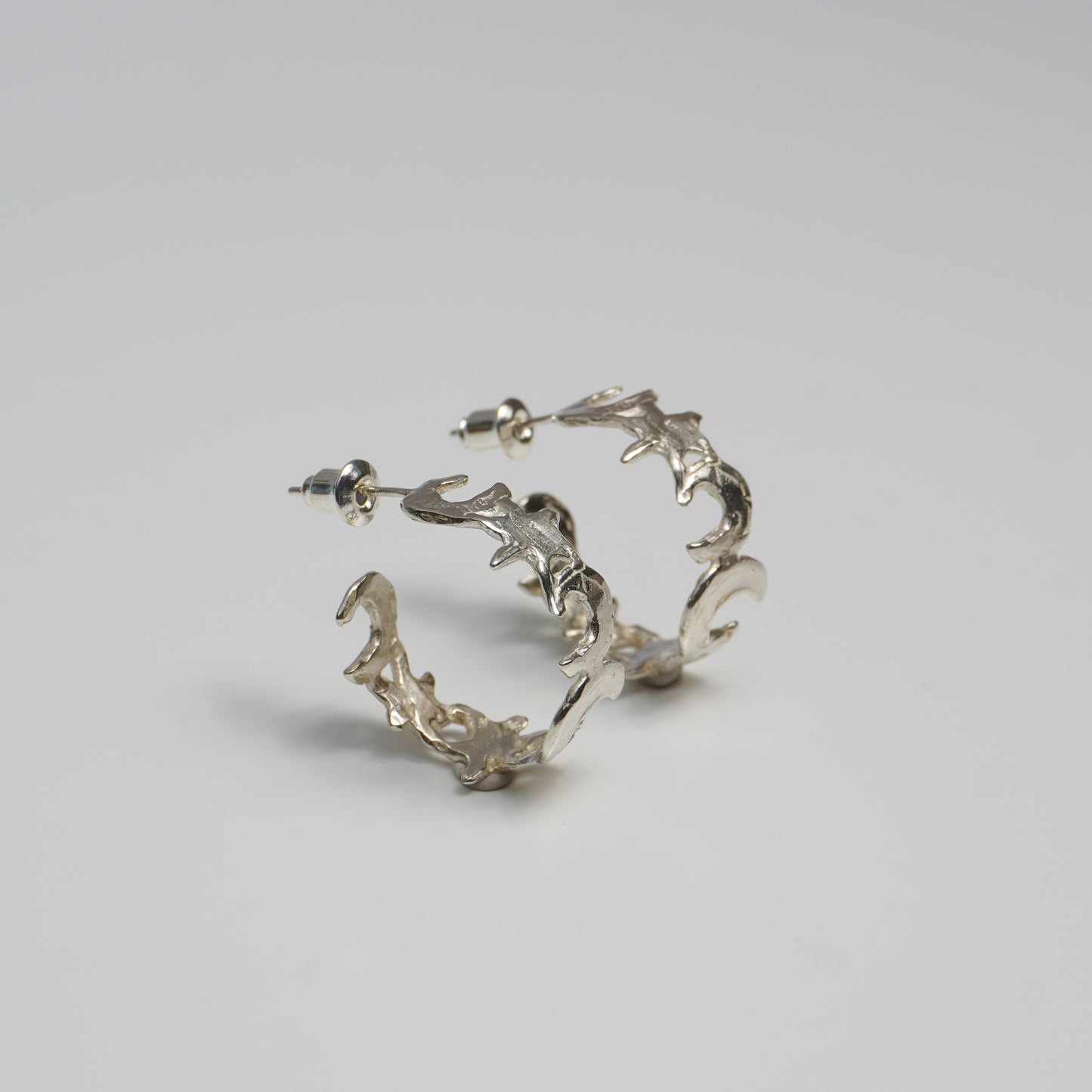 Gold hoop earring with organic moon and star design, celestial nature-inspired jewelry piece, handmade