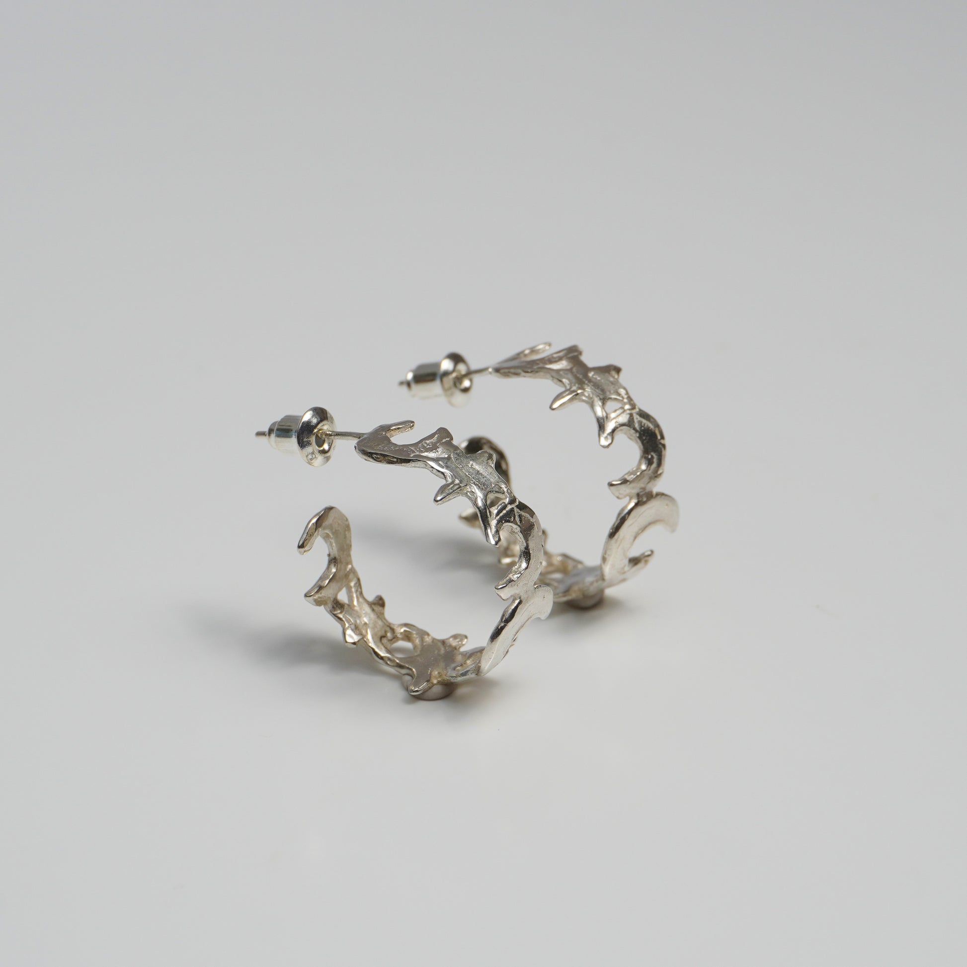 Gold hoop earring with organic moon and star design, celestial nature-inspired jewelry piece, handmade