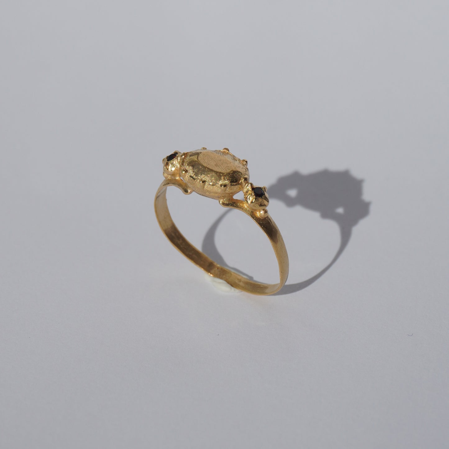 Handcrafted gold-plated ring with organic oval centerpiece and sculpted details