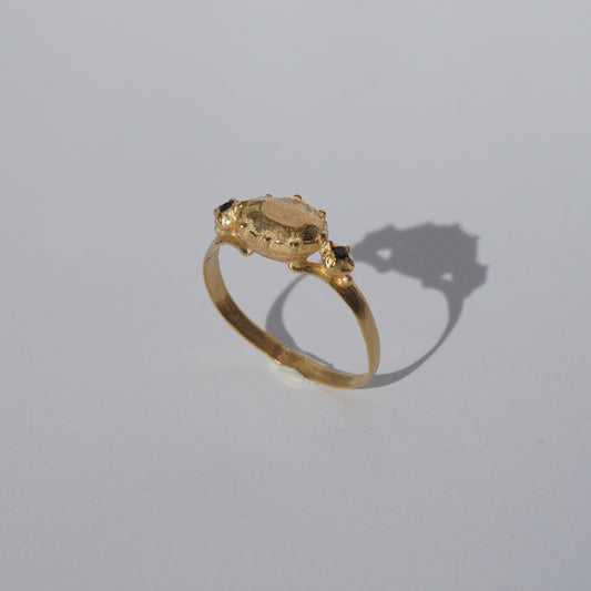 Handcrafted gold-plated ring with organic oval centerpiece and sculpted details