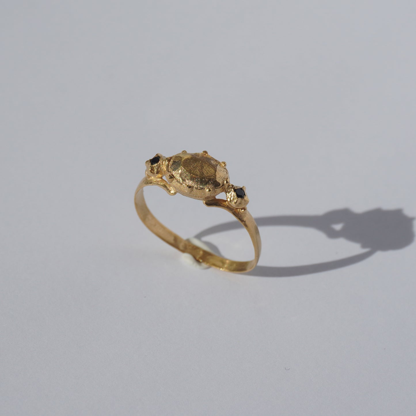 Handcrafted gold-plated ring with organic oval centerpiece and sculpted details