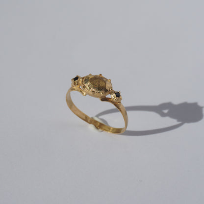Handcrafted gold-plated ring with organic oval centerpiece and sculpted details