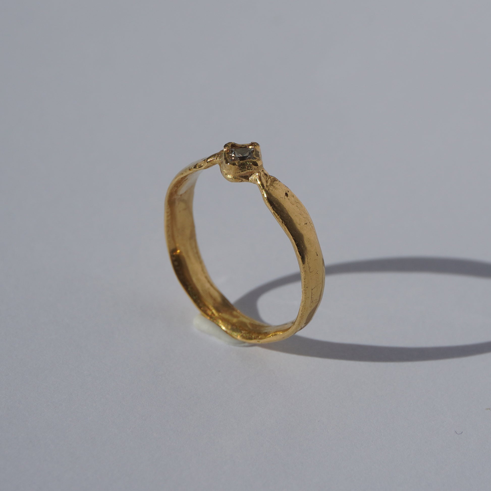 Handcrafted gold-plated ring with organic band and customizable gemstone