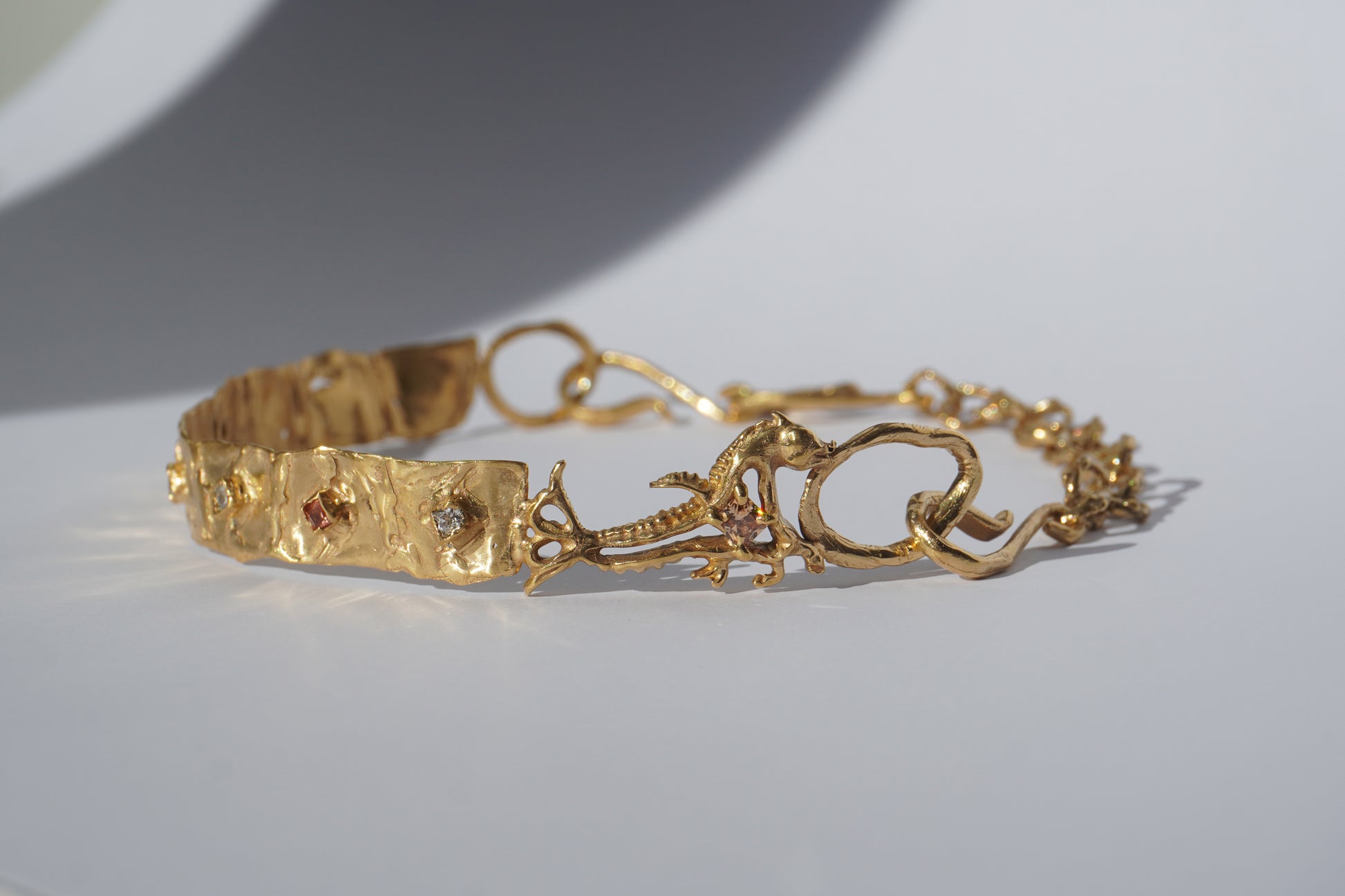 Gold-plated handcrafted choker with organic links and hand-set stones by Tobe Atelier