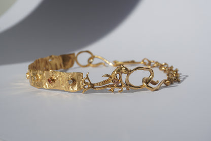 Gold-plated handcrafted choker with organic links and hand-set stones by Tobe Atelier