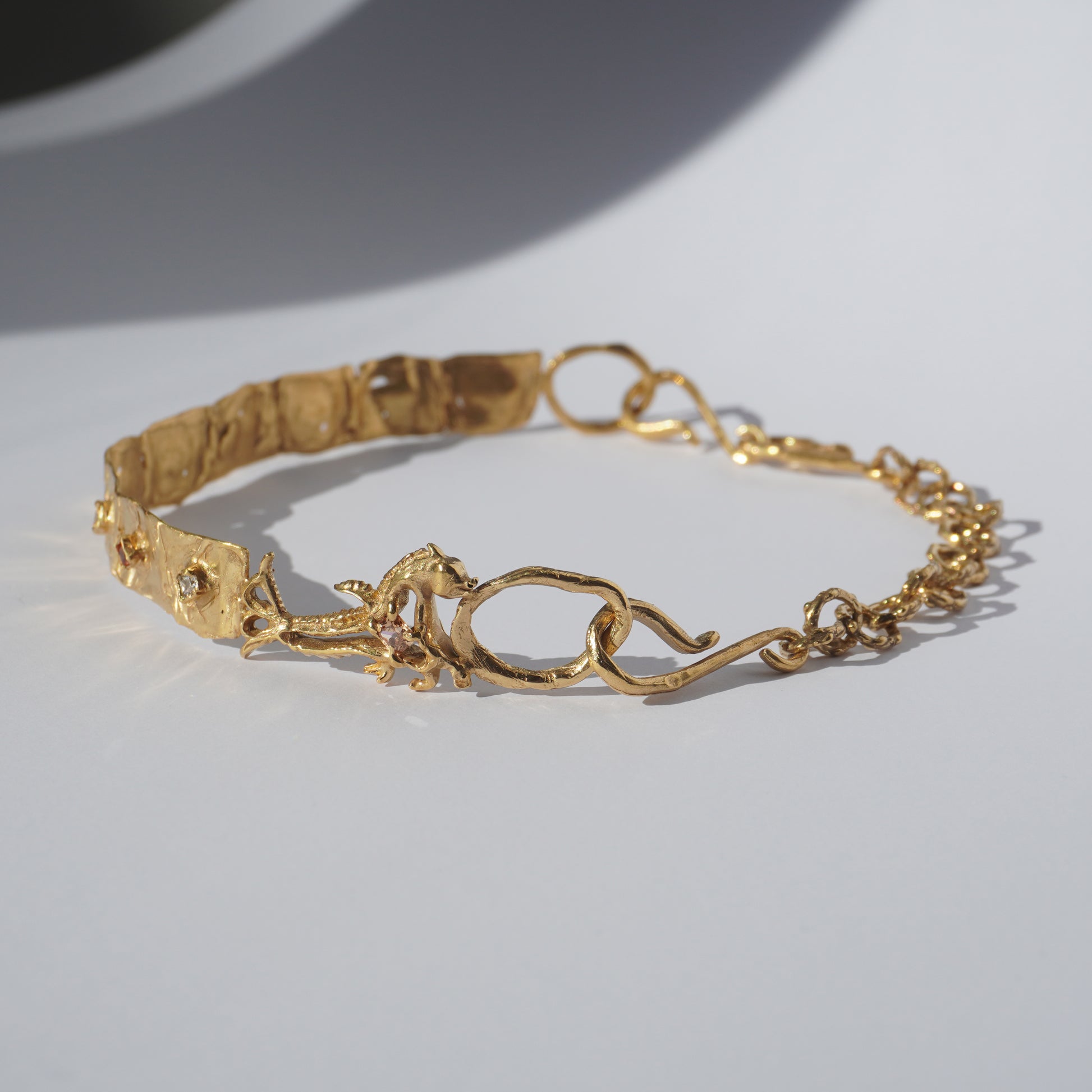 Gold-plated handcrafted choker with organic links and hand-set stones by Tobe Atelier