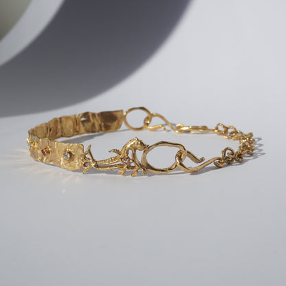 Gold-plated handcrafted choker with organic links and hand-set stones by Tobe Atelier
